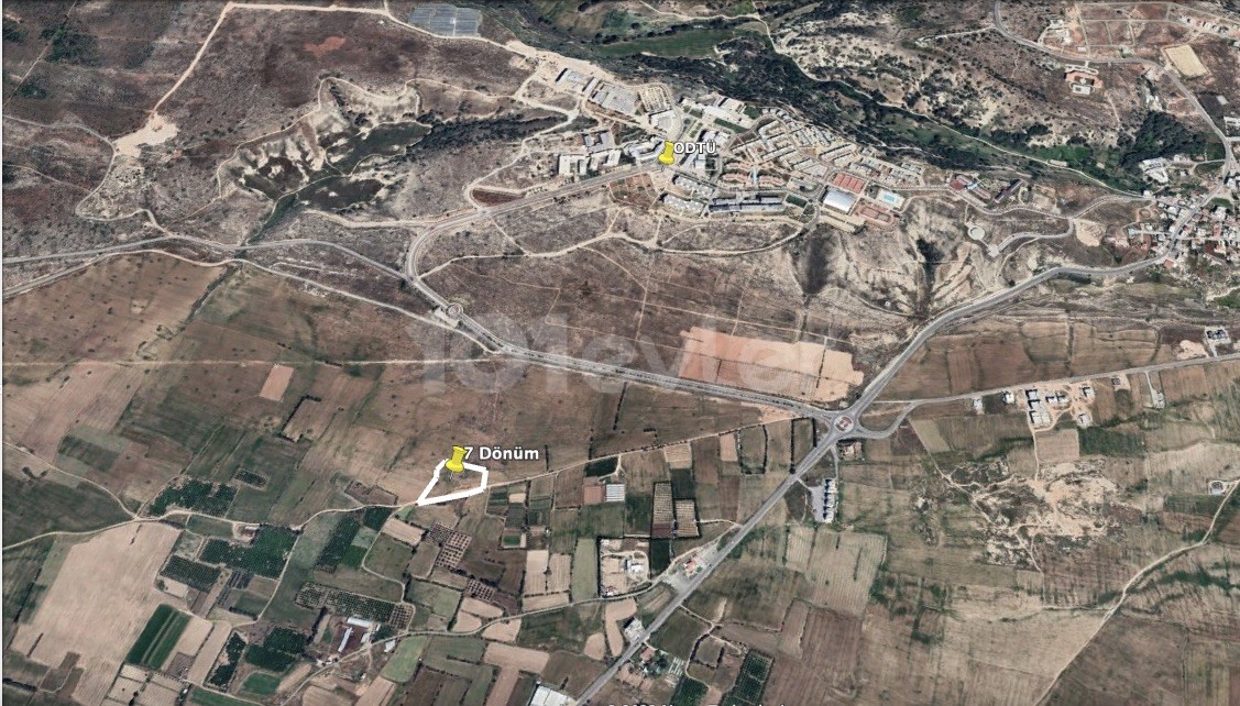 زمین باز برای توسعه با جاده در Kalkanlı، 300 متر از Odtü